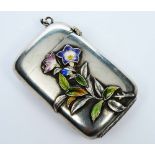 AN UNMARKED METAL VESTA CASE with polychrome enamel, butterfly and floral spray decoration, 4.5cm