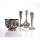 AN INDIAN WHITE METAL PANELLED BOWL with pierced border and chased floor, 12cm; rose water bottle,