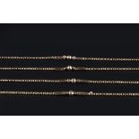 A FANCY-LINK LONG CHAIN, the belcher-link chain spaced by batons and faceted beads, to swivel