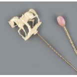 A SMALL COLLECTION OF STICK PINS, comprising a conch pearl stick pin, a Victorian ivory stick pin,