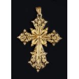 A YELLOW PRECIOUS METAL CROSS PENDANT, of filigree design with beaded accents, length 6.5cm