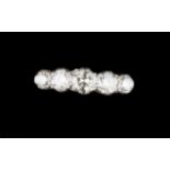 A DIAMOND FIVE STONE RING, the graduated round brilliant-cut diamonds in claw setting, white