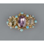 A PINK TOPAZ AND CHRYSOBERYL BROOCH, centred with an oval mixed-cut pink topaz in foiled closed-back