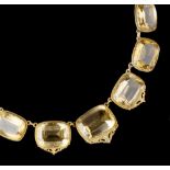 A CITRINE RIVIÈRE NECKLACE, comprising a line of graduated cushion-shaped mixed-cut citrines, in