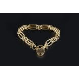 AN 18CT GOLD GATE-LINK BRACELET, with padlock clasp, hallmarked for London 1977, length 17.5cm