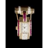 A SYNTHETIC RUBY AND DIAMOND SET BROOCH WATCH, of odeonesque design, the rectangular silvered dial