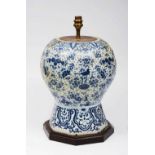 A DELFT BLUE AND WHITE TABLE LAMP of baluster form, painted with birds and flowering foliage (