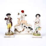 A PAIR OF STAFFORDSHIRE POTTERY FIGURES of a boy and girl with painted decoration on square bases,