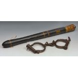 A VICTORIAN PAINTED AND TURNED POLICE TRUNCHEON 46.5cm long; and a pair of steel handcuffs (2)