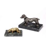 A SILVERED METAL FIGURE OF A DACHSHUND on rectangular marble plinth base, 15cm wide; and a gilt