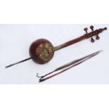 AN OLD MIDDLE EASTERN SPIKE FIDDLE with hide covered body and turned hardwood neck, with
