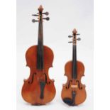 A CONTINENTAL VIOLIN with two piece back, 58.5cm; and a quarter sized violin (2)