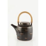 Lowerdown Pottery Teapot tenmoku brushwork, cane handle impressed pottery seal 19cm across.