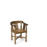 Robert Thompson (1876-1955) of Kilburn Mouseman armchair oak with tan leather seat, and lattice back