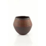 John Ward (b.1938) Vase red glaze impressed potter's seal 7.3cm high, 8.8cm across. Provenance: