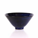Tessa Fuchs (1936-2012) Footed bowl blue glaze impressed potter's seal 7.5cm high, 15.5cm diameter.