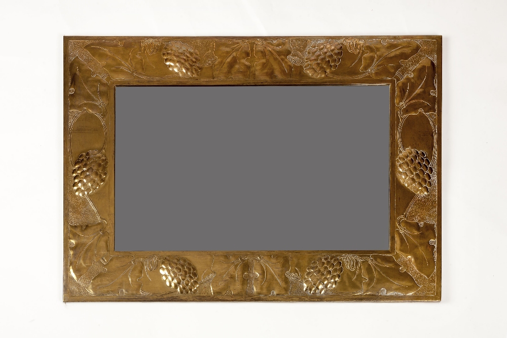 Arts & Crafts School Wall mirror brass, hammered and repoussé decorated with grapes and vines 63cm x