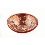 Alan Caiger-Smith (b.1930) Bowl ruby red lustre painted potter's monogram 24.8cm diameter.