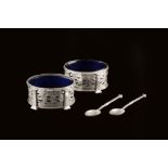 Omar Ramsden (1873-1939) Pair of salts with blue glass liners each hallmarked for London 1920