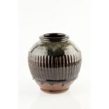 Mike Dodd (b.1943) Vase fluted potter's seal covered with glaze 23cm high.