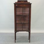 An Edwardian mahogany and inlaid display cabinet,