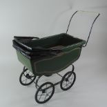 A vintage Triang painted metal doll's pram,