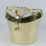 A brass ice bucket, in the form of a hat box,