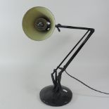 A mid 20th century black painted metal angle poise lamp,