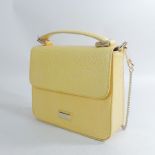A yellow leather handbag, by Osprey,