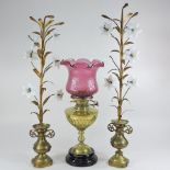 A 19th century brass oil lamp, together with a pair of brass flower ornaments,