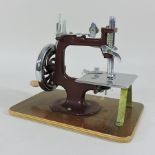 A 1950's 'The Essex' sewing machine, in a leather case,