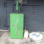 A green painted oil pump and tank, 51cm,