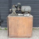 An air compressor, on a wooden stand, by BEN, Nurnburg,
