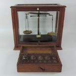 A set of early 20th century balance scales, by Griffin and Tatlock Ltd, in a fitted case, 40cm tall,