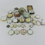A collection of pocket watches and alarm clocks
