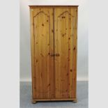 A modern pine double wardrobe,