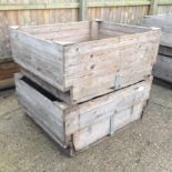 A set of three large wooden apple crates,