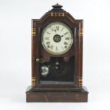 A mahogany mantel, clock with an eight day movement,