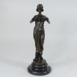 A bronze figure of a girl, holding flowers,
