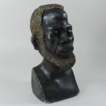 An African carved hardwood portrait bust of a man,