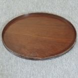 A George III mahogany oval butler's tray, with a brass gallery,