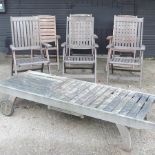 A set of three hardwood folding garden chairs,