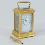 A miniature brass cased carriage clock,