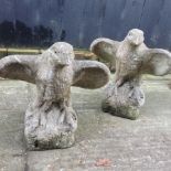 A pair of reconstituted stone eagles,