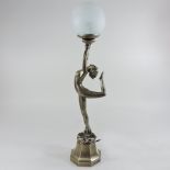 An Art Deco style figural table lamp, with a white glass shade,