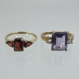 A 9 carat gold amethyst and diamond ring, together with a 9 carat gold garnet three stone ring,