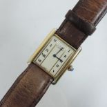 A Must de Cartier ladies silver cased wristwatch on a brown leather strap