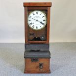 Withdrawn - An early 20th century clocking-in clock,