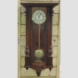 A Victorian walnut cased Vienna regulator,