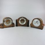 A 1930's walnut cased mantel clock, together with two others,